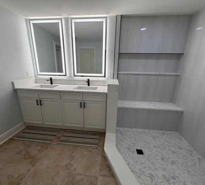 Start your day with plenty of space—double sinks, bright lighting, and a large walk-in tiled shower make mornings easy for everyone. Located off the primary bedroom