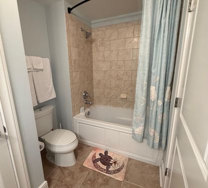 Third full bathroom with granite vanity and tub/shower combo—perfect for keeping everyone comfortable during busy beach mornings. Bathroom #3 is located off the Queen guest bedroom