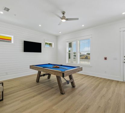 Enjoy a Game of Pool or Catch the Game on the Flat-Screen TV