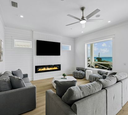 Spacious & Inviting Living Area Offering An Electric Fireplace