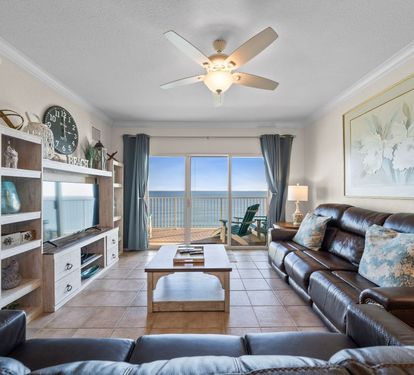 Unwind in your oceanfront living room where leather seating faces stunning sea views through floor-to-ceiling windows.