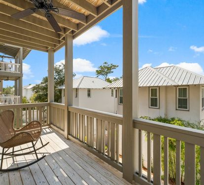 Rocking chairs and a Gulf breeze on the wraparound porch