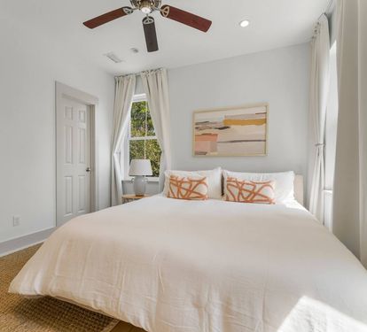 Second-floor King Suite 3 is on the quiet back side of the house with soft coastal light
