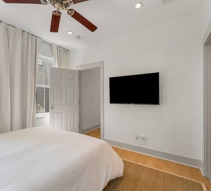 Wind down in the quiet second-floor King Suite 3 with a smart TV and floor to ceiling heavy drapes