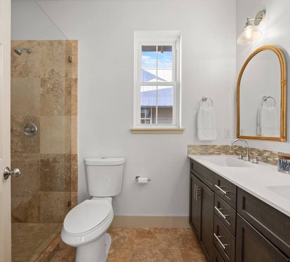 The ensuite bathroom for the 2nd bedroom has dual sinks and a large shower