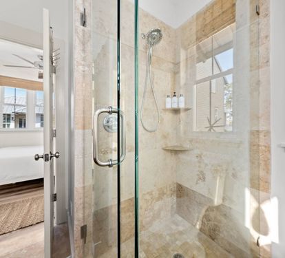 Rinse off the beach day in a roomy stone-tiled shower