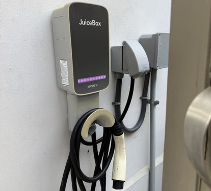 Convenient on-site EV charger in the covered parking area