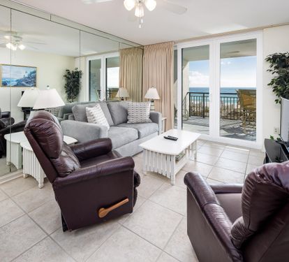 Living Area with Sofa Bed and Floor to Ceiling Sliding Glass Door to Balcony