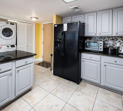 Kitchen and entry with laundry closet