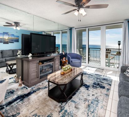 Living room with fireplace  and balcony access