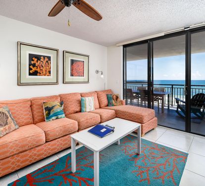 Sectional couch living room with balcony access