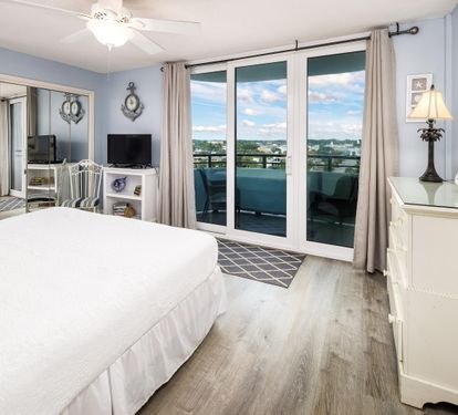 Guest Bedroom with Floor to Ceiling Sliding Glass Doors to Private Juliet Balcony with Views of Intracoastal Waterway