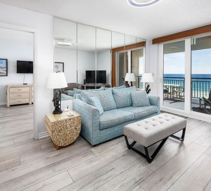 Living room with sofabed couch and balcony access