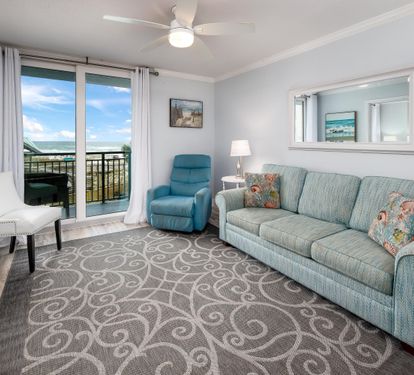 Living room with recliner and balcony access