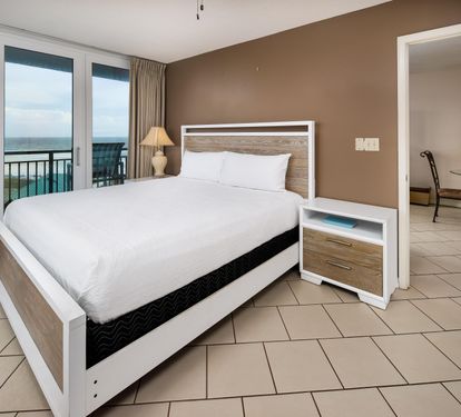 Master bedroom king with balcony access