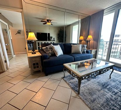 Living Room with balcony access and master bedroom entrance