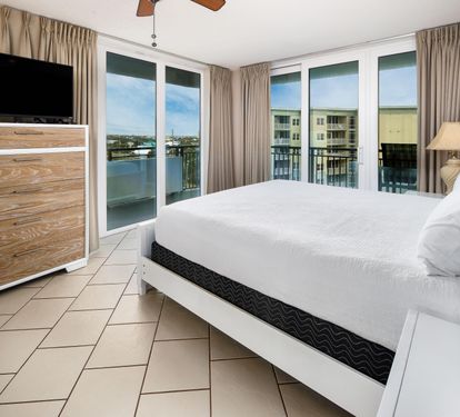 Master bedroom king with balcony access
