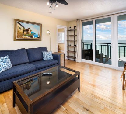 Living room sofa bed with balcony access