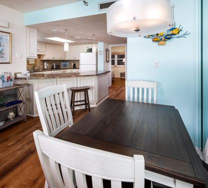 Dining area seats 4 with 2 bar stools
