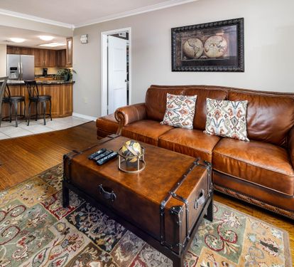 Living room open to dining and kitchen