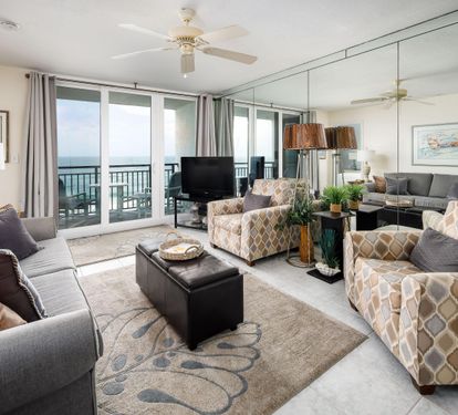 Living room with sofabed couch and balcony access