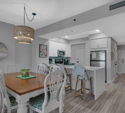 Open dining area and updated kitchen.