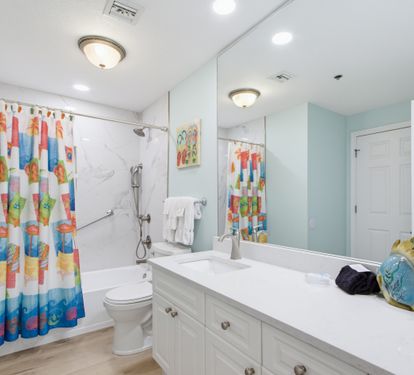 Second bathroom with tub-and-shower combination.