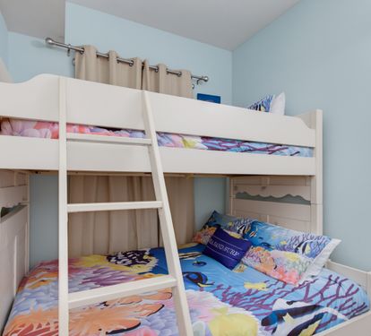 Private bunk room with a twin-over-full bunk bed and a TV.