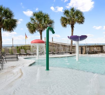 Zero-entry children’s splash pool overlooking the Gulf.