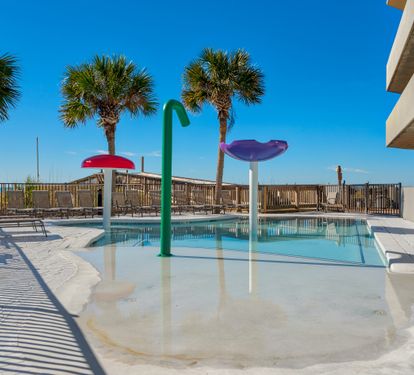 Zero-entry children's splash pool beside the beach.