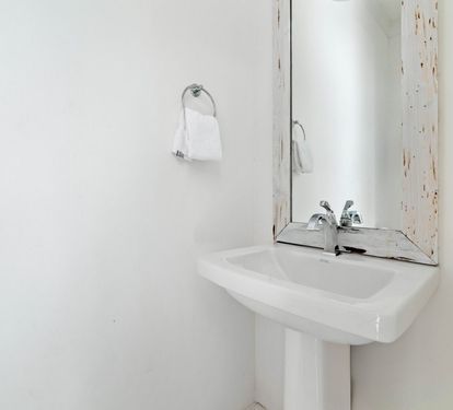 Conveniently Located Exterior Half Bath Off the Pool Deck