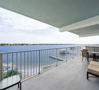 Compass Point 308 Balcony with Comfortable Outdoor Seating & Dining