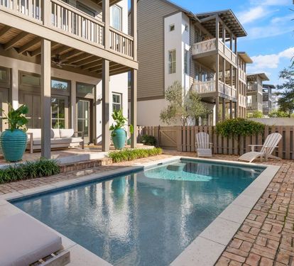 Settle onto the covered patio sofas just steps from the water for a shaded break between swims.